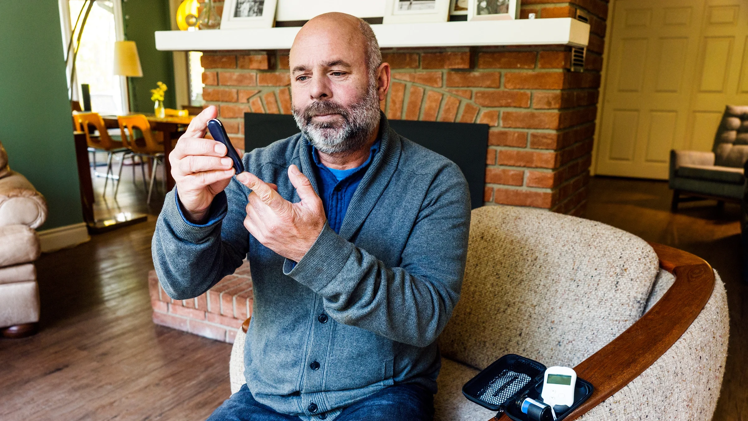 Man checking blood sugar level.