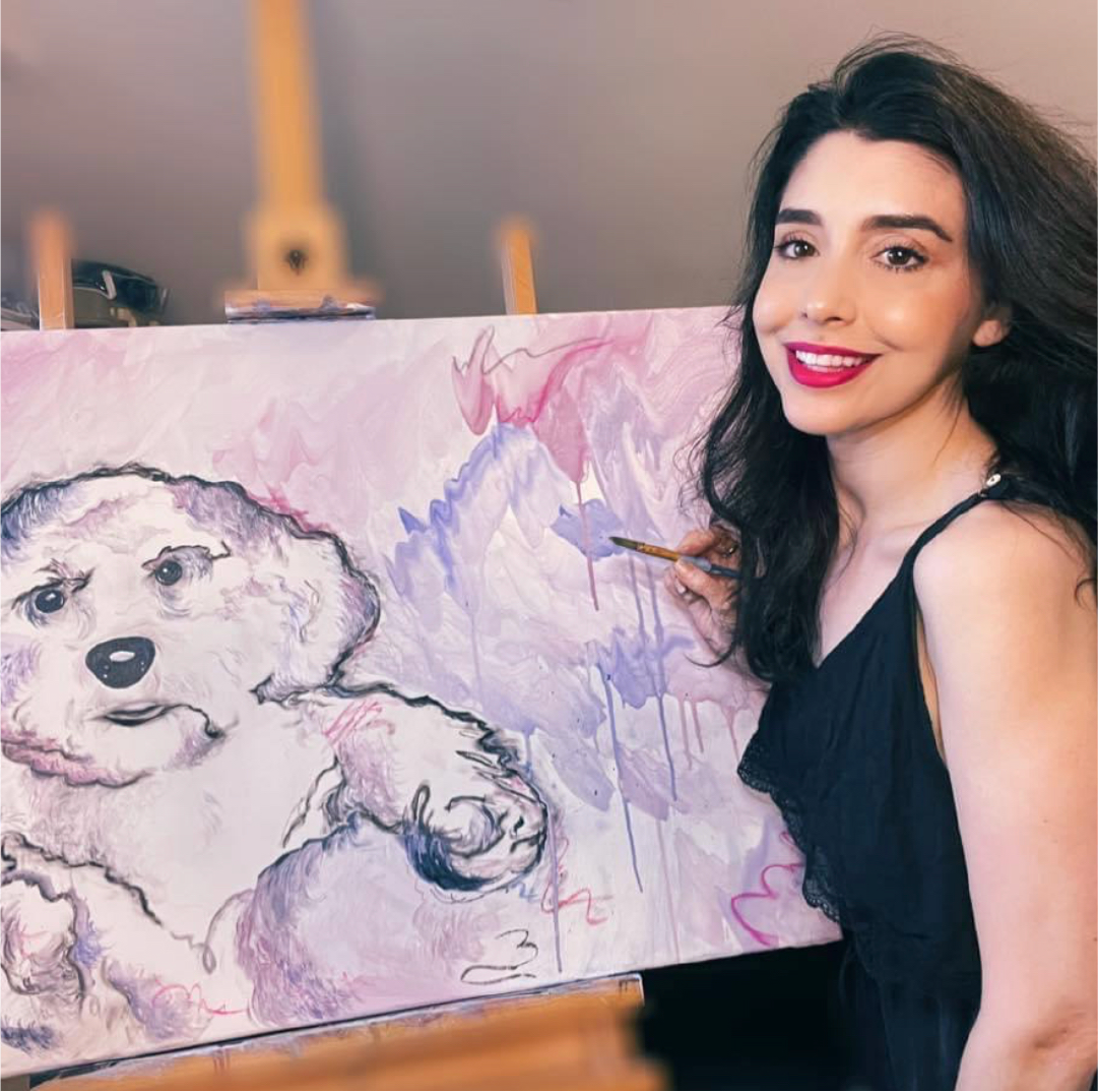Marisa Zeppieri is pictured painting a portrait of a dog.
