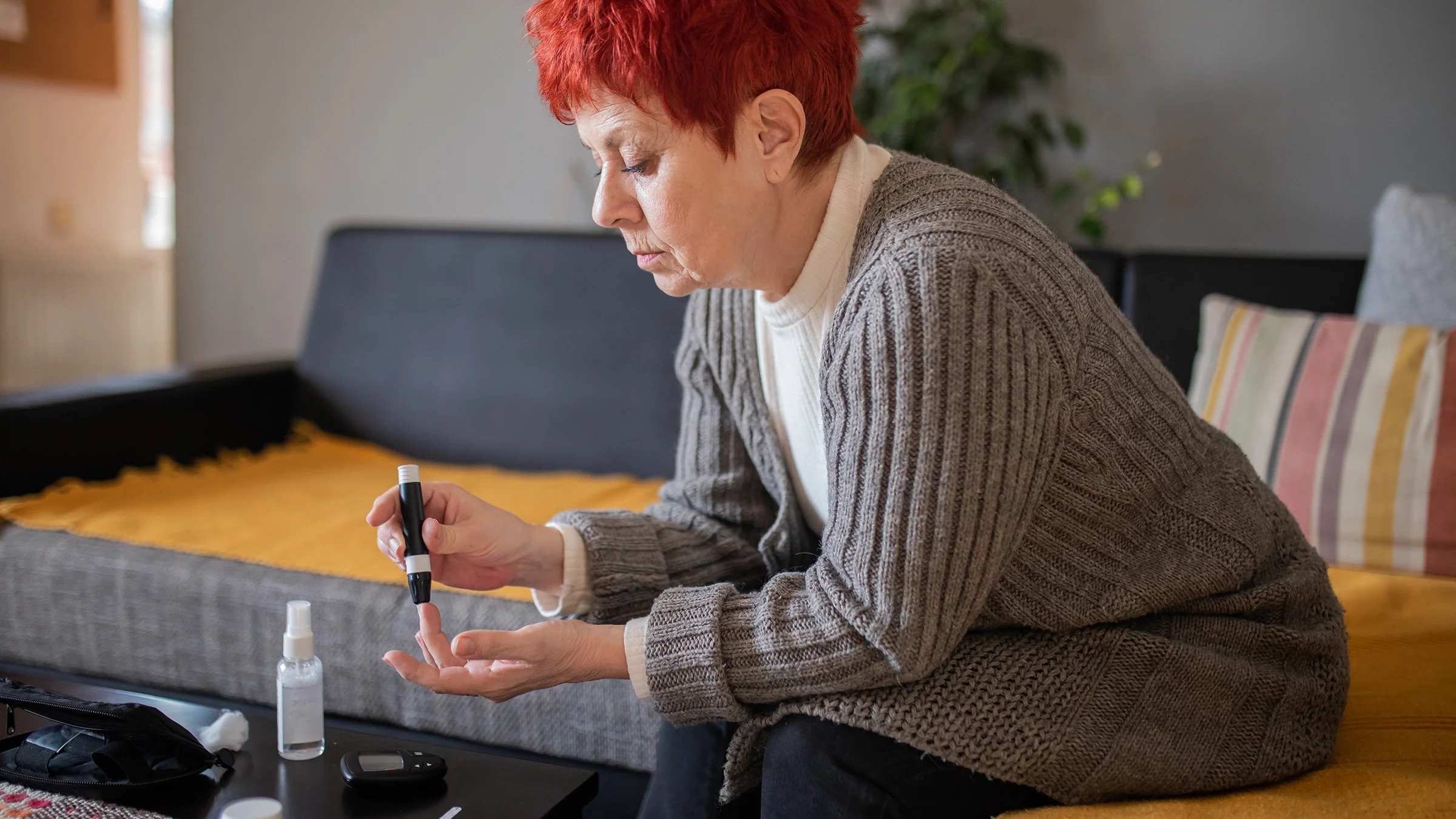 A woman checks her blood sugar level.
