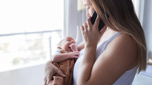 Urology: holding baby calling doctor 1423137792