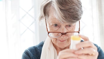 Dementia: Xanax and valium: examining pill bottle closely-1155142035