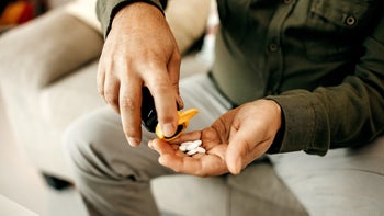 Health: Jardiance: closeup hands pouring medication into palm 1291278194