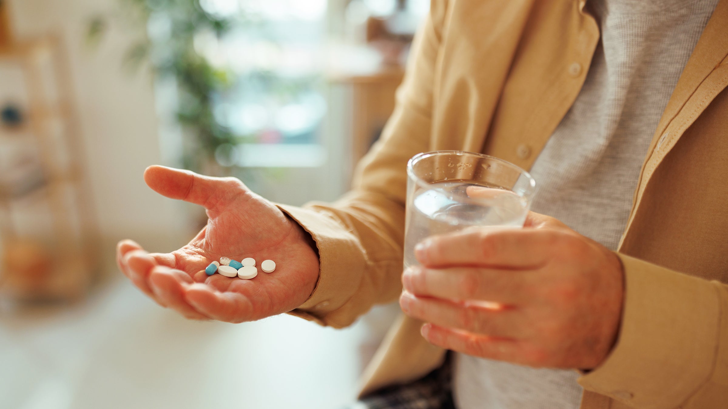 SSRIs: closeup hand with pills 1463754712