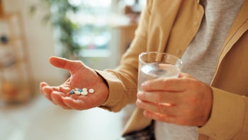 SSRIs: closeup hand with pills 1463754712