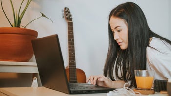 Medicaid: typing on laptop 1250316064
