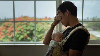 Perinatal depression: Men: stressed dad baby in sling 1358324680