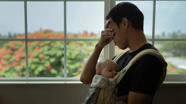 Perinatal depression: Men: stressed dad baby in sling 1358324680