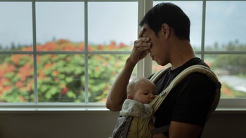 Perinatal depression: Men: stressed dad baby in sling-1358324680
