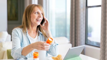 Pharmacy: woman refilling prescrption 1168475196