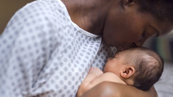 Health: Pregnancy: mother kissing newborn baby 952682282