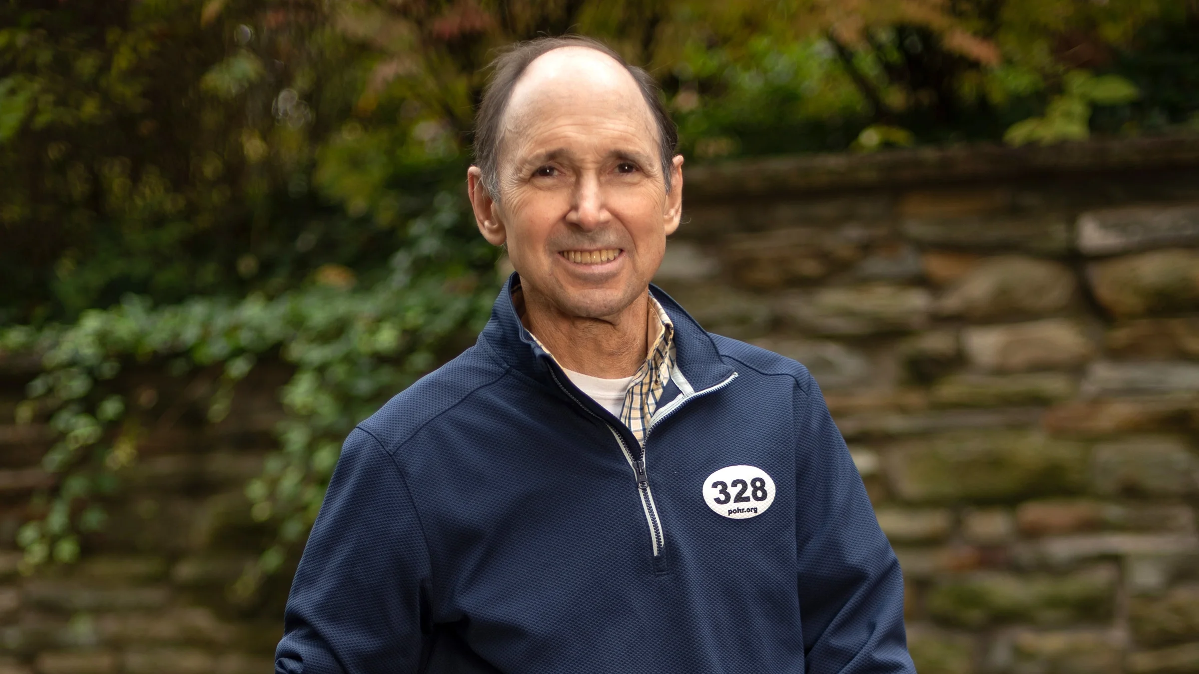 James "Jim" Bond smiling outside.