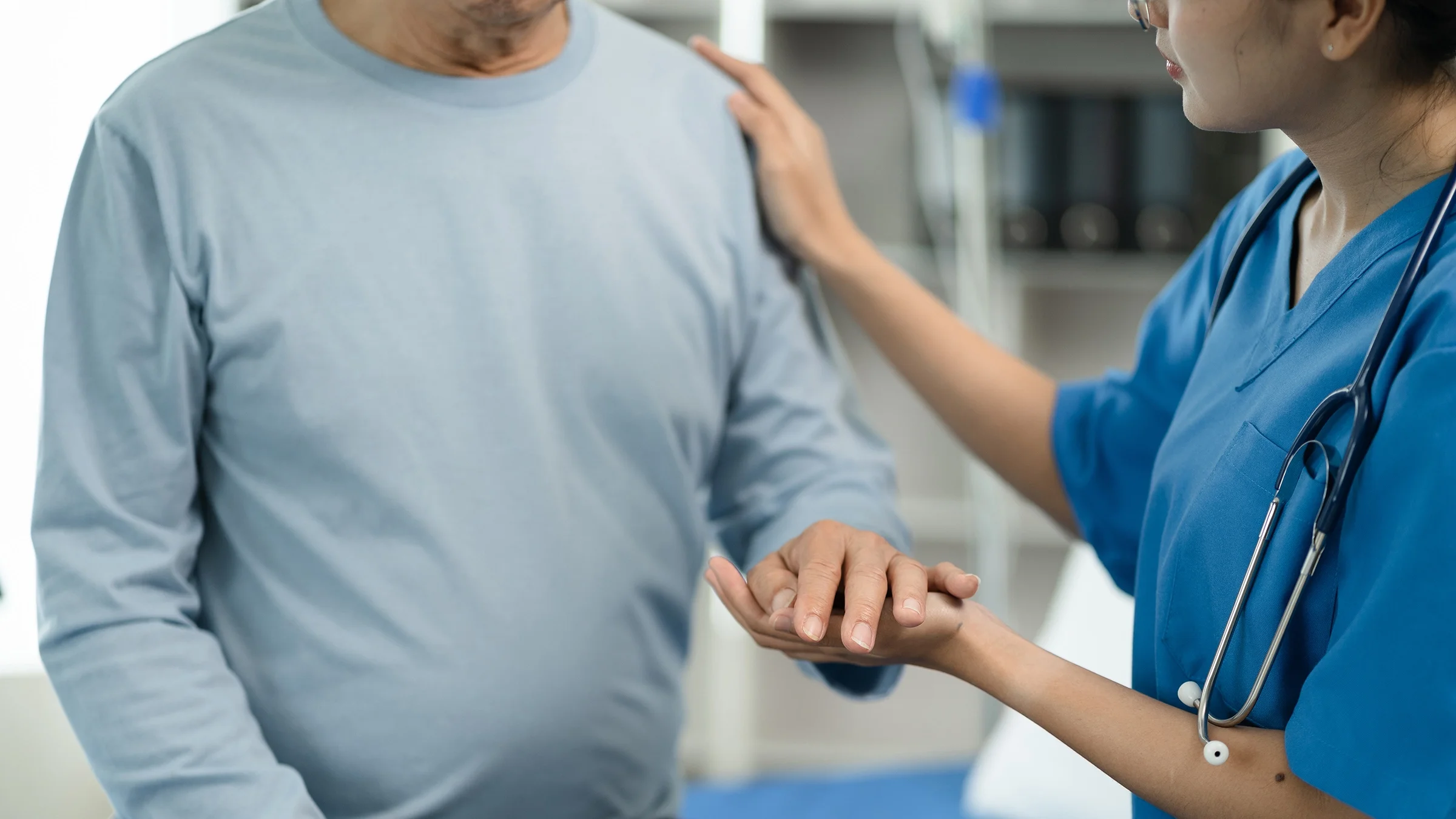 Close-up medical professional caring for patient.