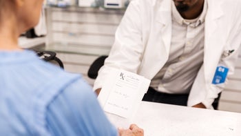 Ropinirole: closeup customer with pharmacist 1419113235