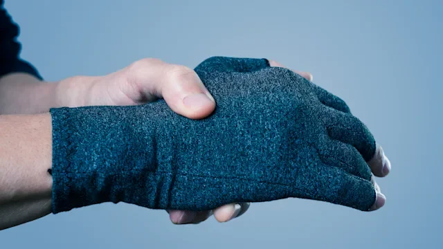Arthritis: closeup hand compression glove 1198620244