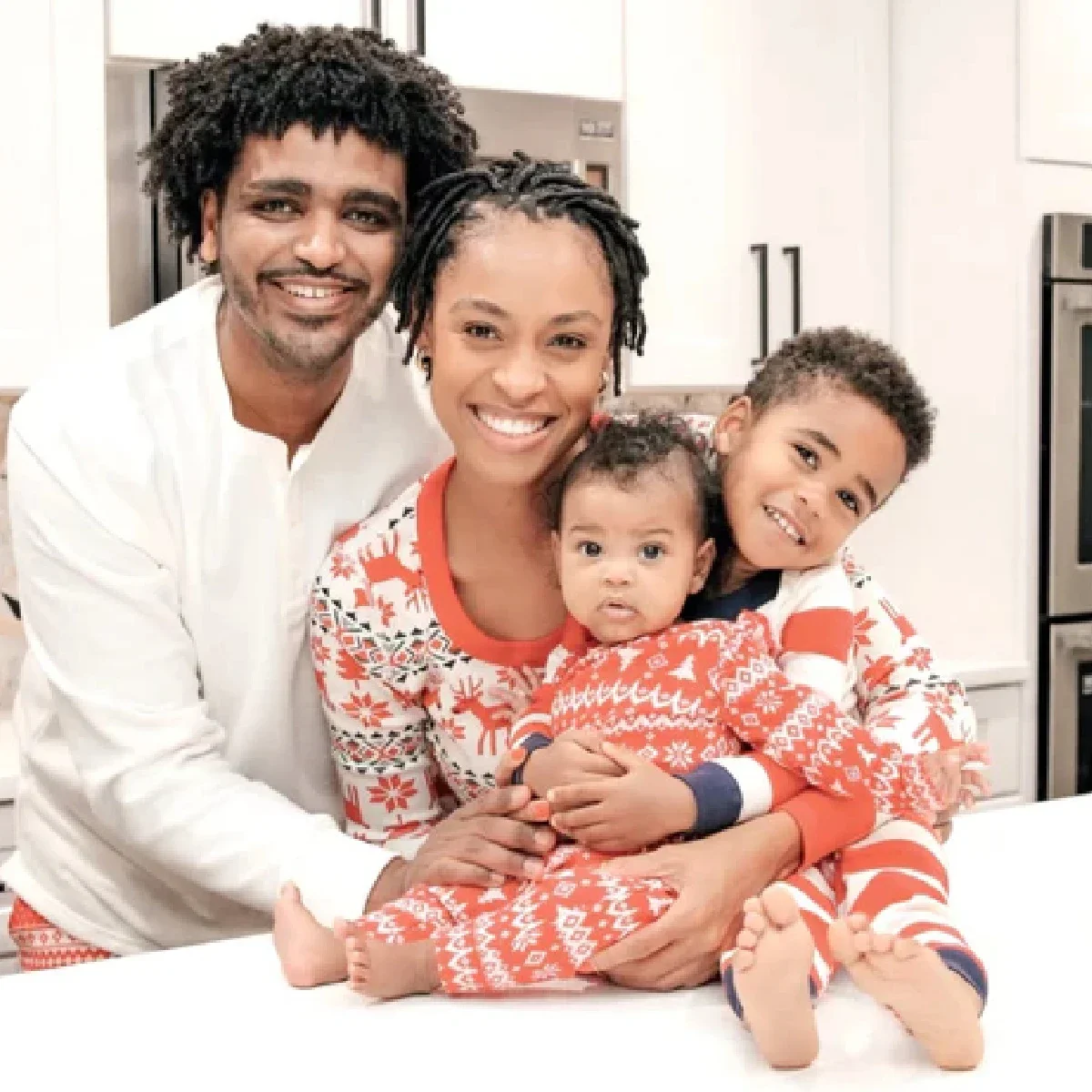Tyler Whitley is pictured in a snapshot with her husband and two kids.