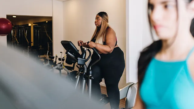 movement-exercise: woman exercising on an elliptical machine 1638716793