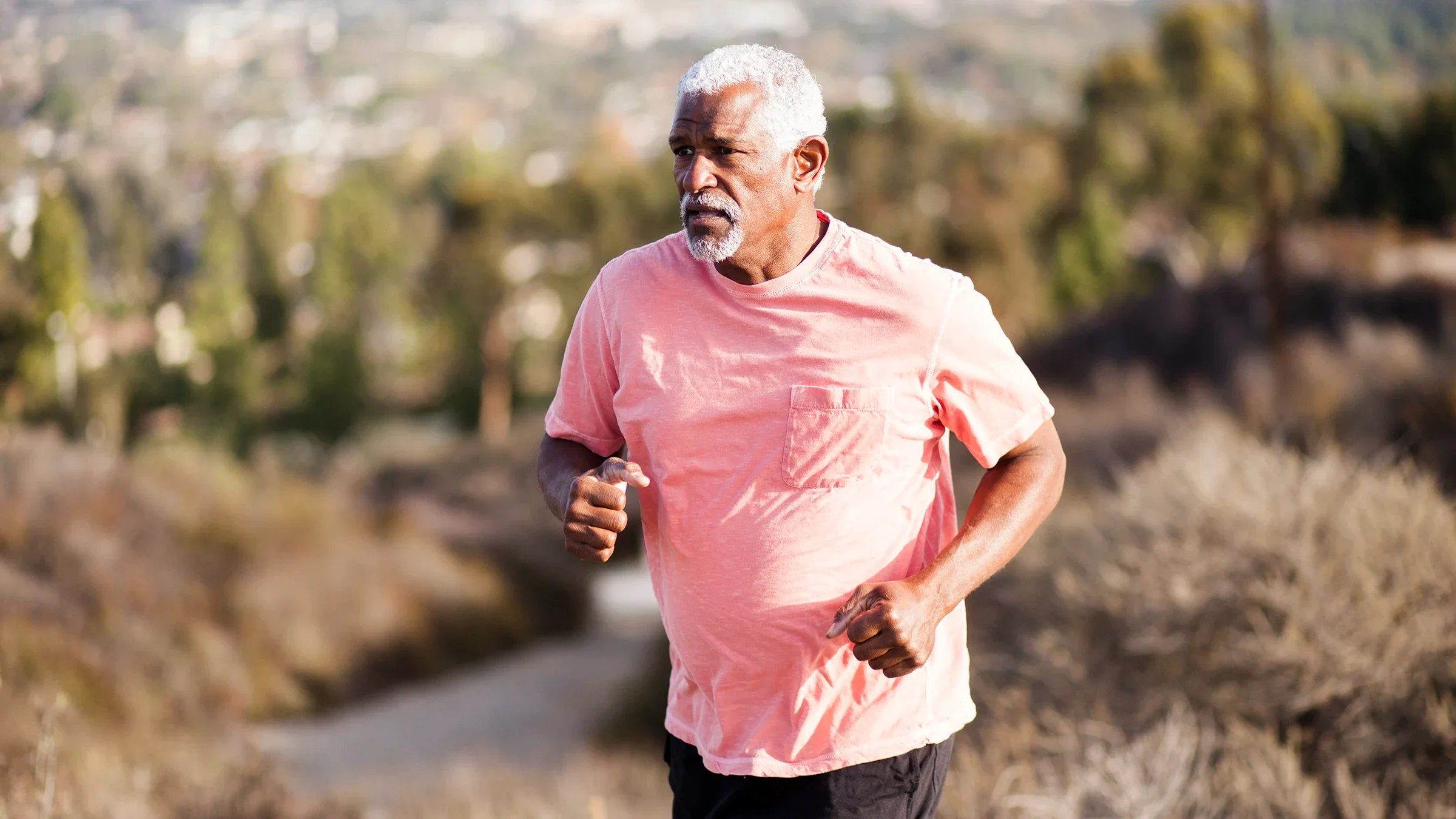 Man jogging outdoors.
adamkaz/E+ via Getty Images