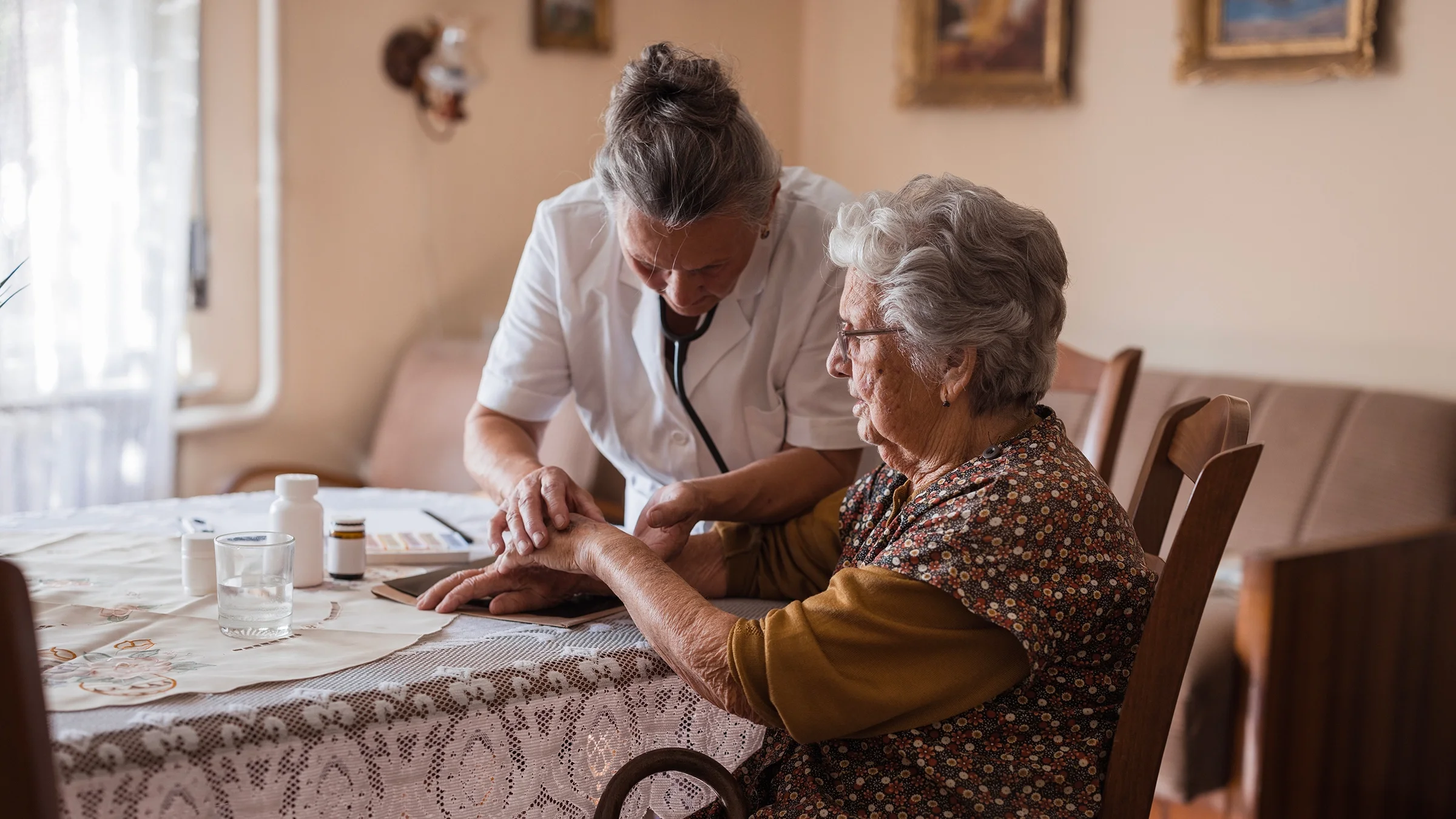 Medical professional examining a senior patient