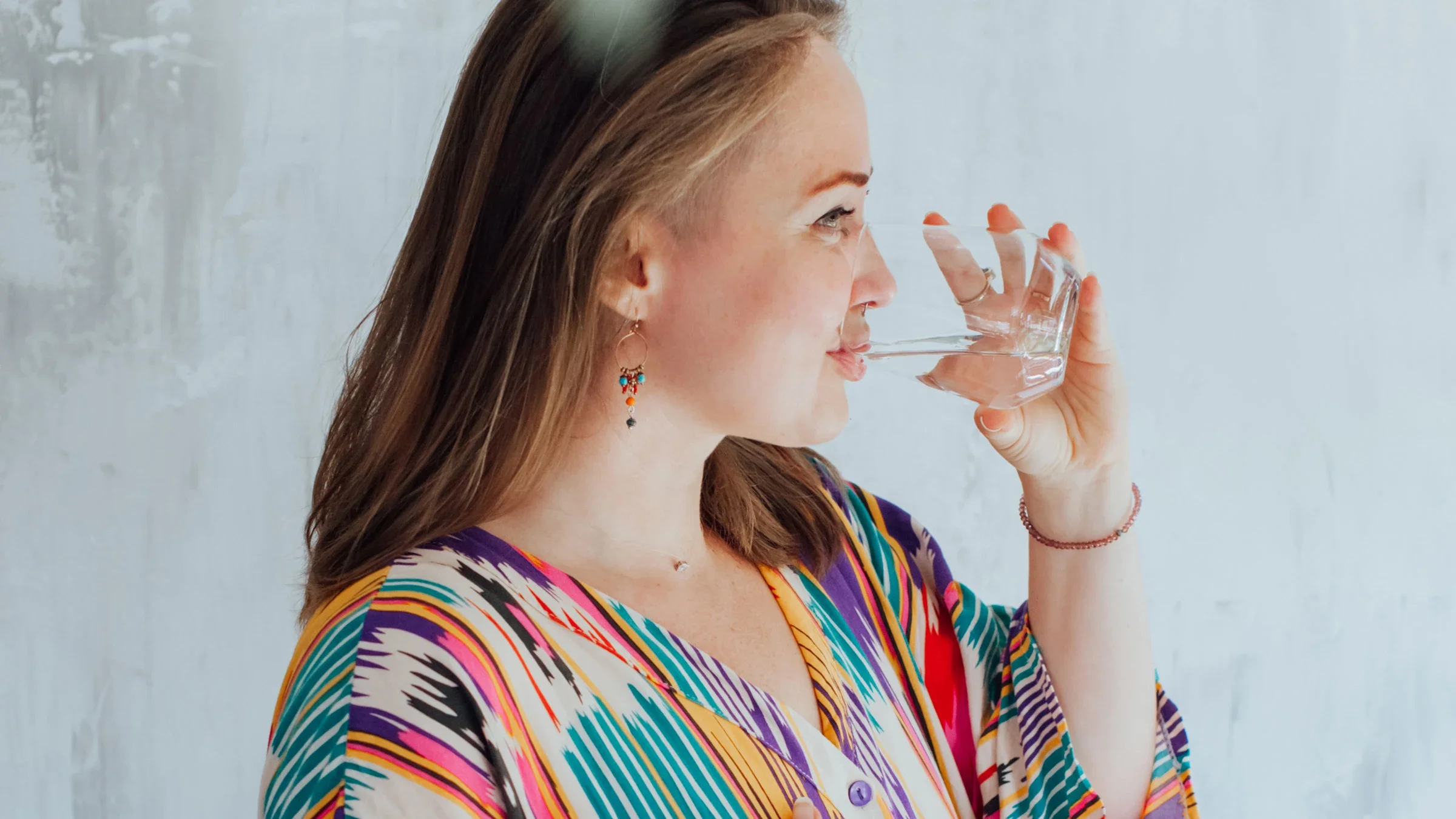 A plus-size person drinking water.
MiMaLeFi/iStock via Getty Images Plus 
