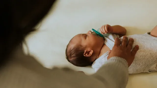 Children's health: checking on sleeping baby 1060797628