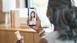 A woman speaks to a healthcare provider about her medication during a telemedicine appointment.
SDI Productions/E+ via Getty Images