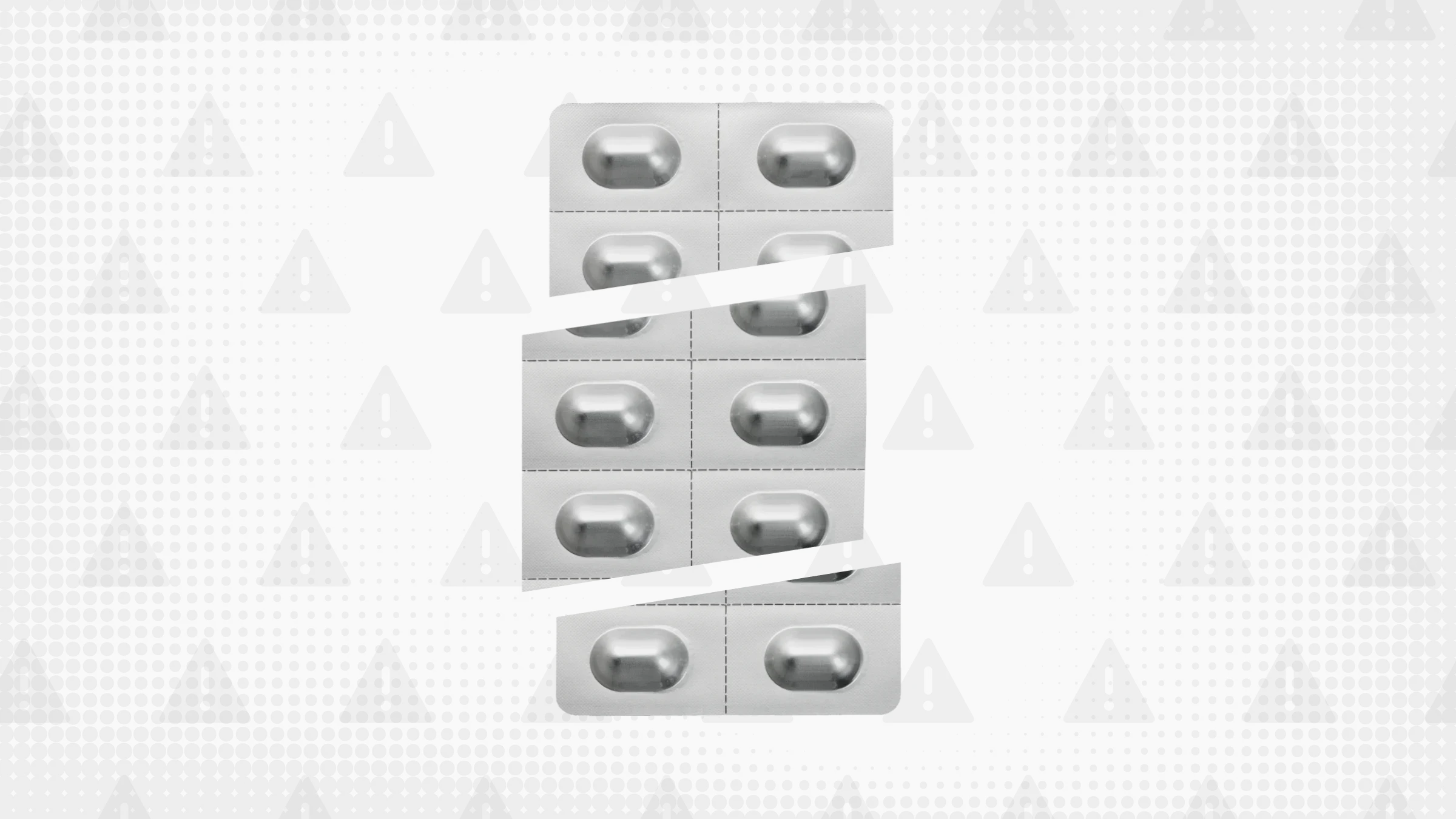 A gray background with texture and warning sign pattern. In the center is a silver blister pack of pills cut into thirds.
GoodRx Health