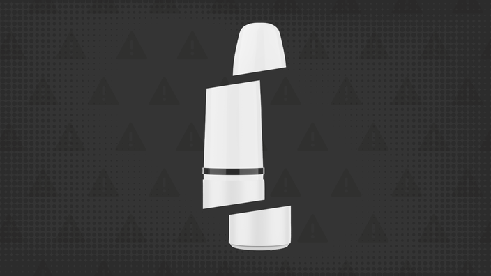 Black background with texture and warning sign pattern. In the center is a white nicotine nasal spray bottle cut into thirds. 