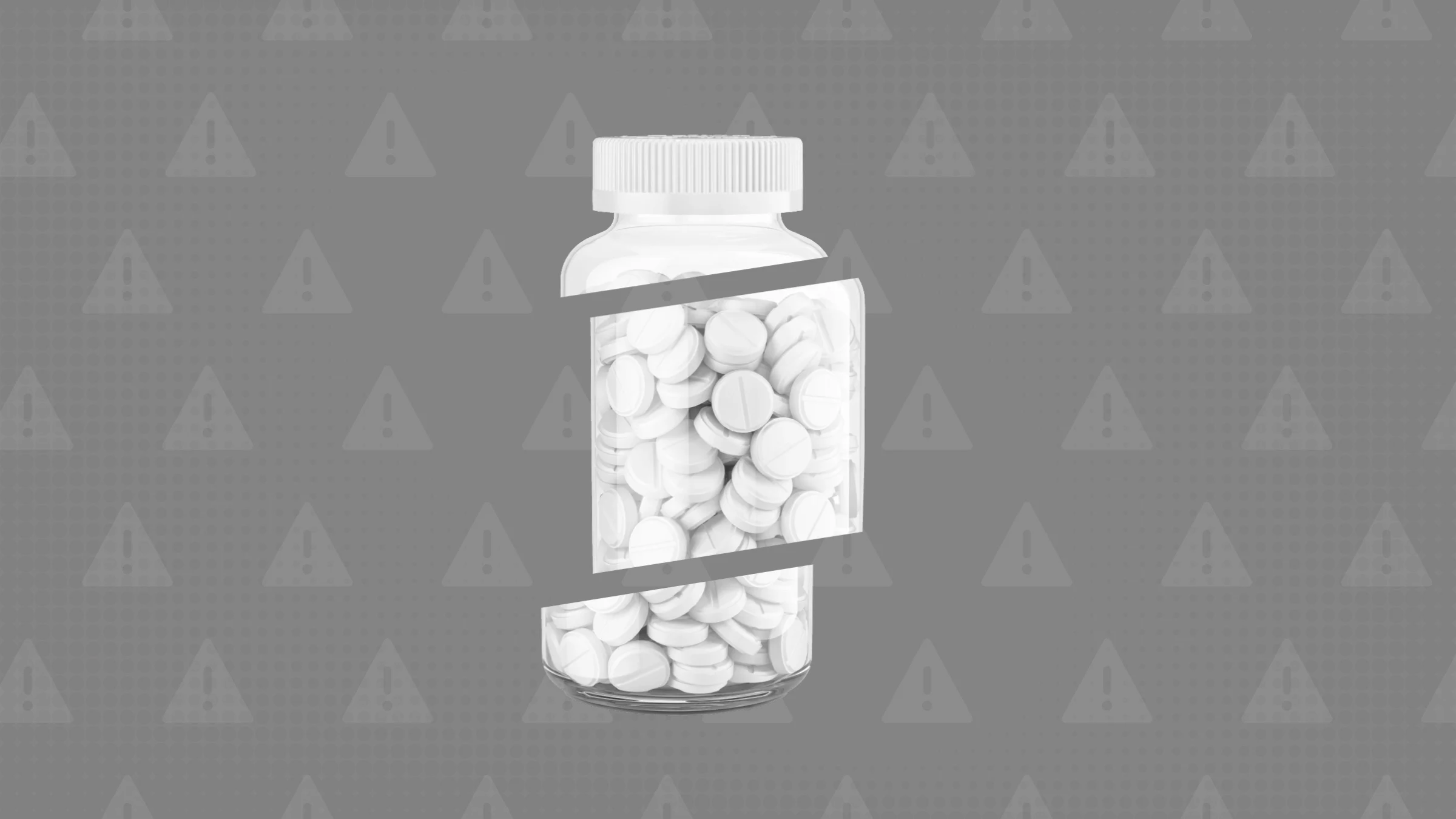 In the center of a medium gray background with texture and white warning sign pattern is a clear bottle with white pills that’s cut into thirds.