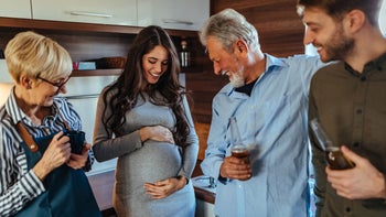 Pregnant: Alcohol: pregnant-person-with-drinking-family-members-1279484887
