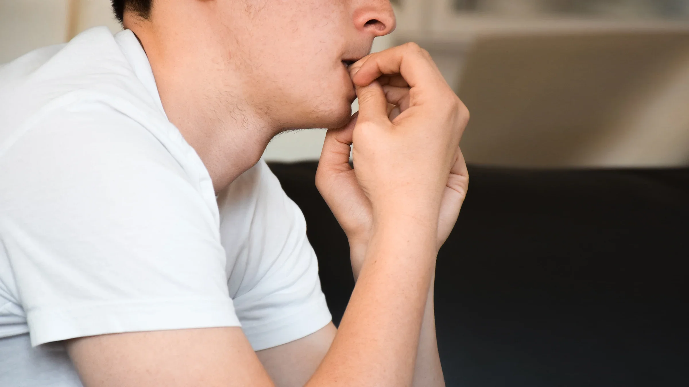 Close-up teenager biting nails.
JulieAlexK /iStock via Getty Images Plus