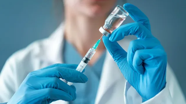 HCP: closeup syringe and vial 1136527910