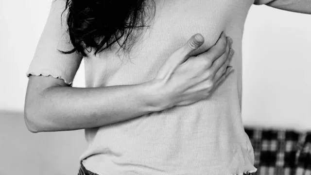 closeup woman sore breast-1203048937 BW