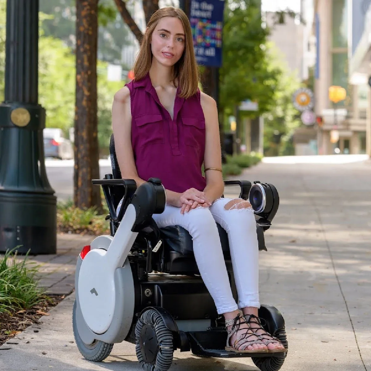 Carden Wyckoff is pictured outdoors, in her wheelchair.