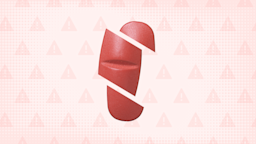 In the center of a light red background with texture and warning sign pattern is a light red pill cut into thirds. 
GoodRx Health