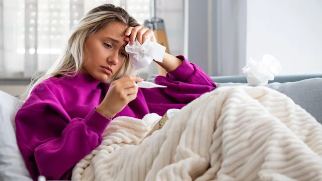 Alcohol: sick person on couch 1175000095