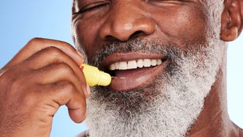 Health-Insurance: closeup man using chapstick 1395676785