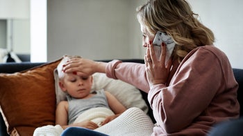 Health: Childrens health: mother aiding sick child 1219051568