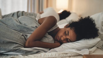 woman in bed lack of sleep 1163500856