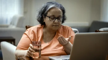 dementia:woman taking medication 2218264257