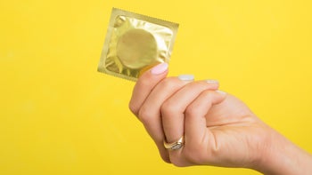 Health: Sexual Health: hand holding condom wrapper 639467544