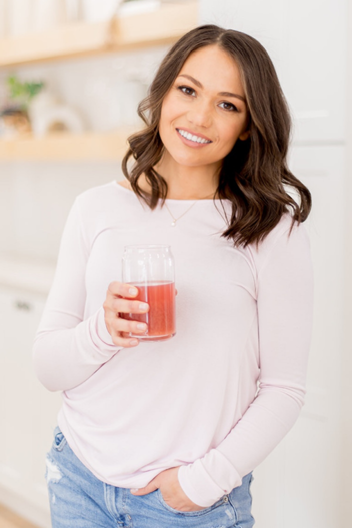 Julie Balsamo is pictured holding a drink.