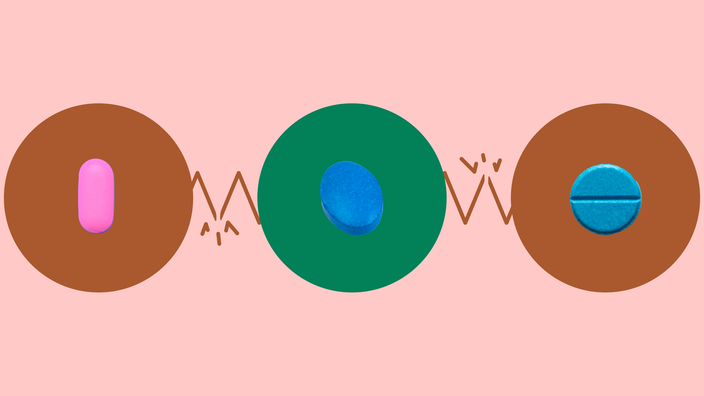 Light red-pink background with three circles across the middle of the frame. In the center, on a green circle, is an oval dark blue pill. On the left, on a red circle, is an oblong pink pill. On the right, on a red circle, is a round blue pill.