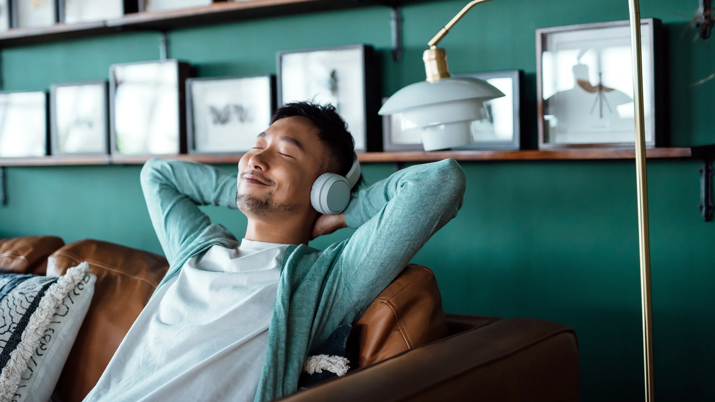  A man smiles while listening to music. Your brain releases dopamine when you experience something pleasurable and enjoyable. 