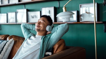 Health: Mental health: man smiling listening to music 1384444016