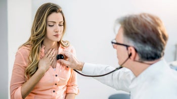 Heart: doctor listening to heart 960423478