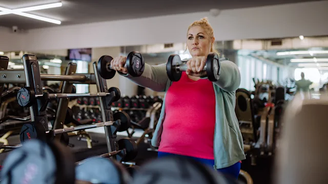 Movement Exercise: woman front raise exercise 1364350897