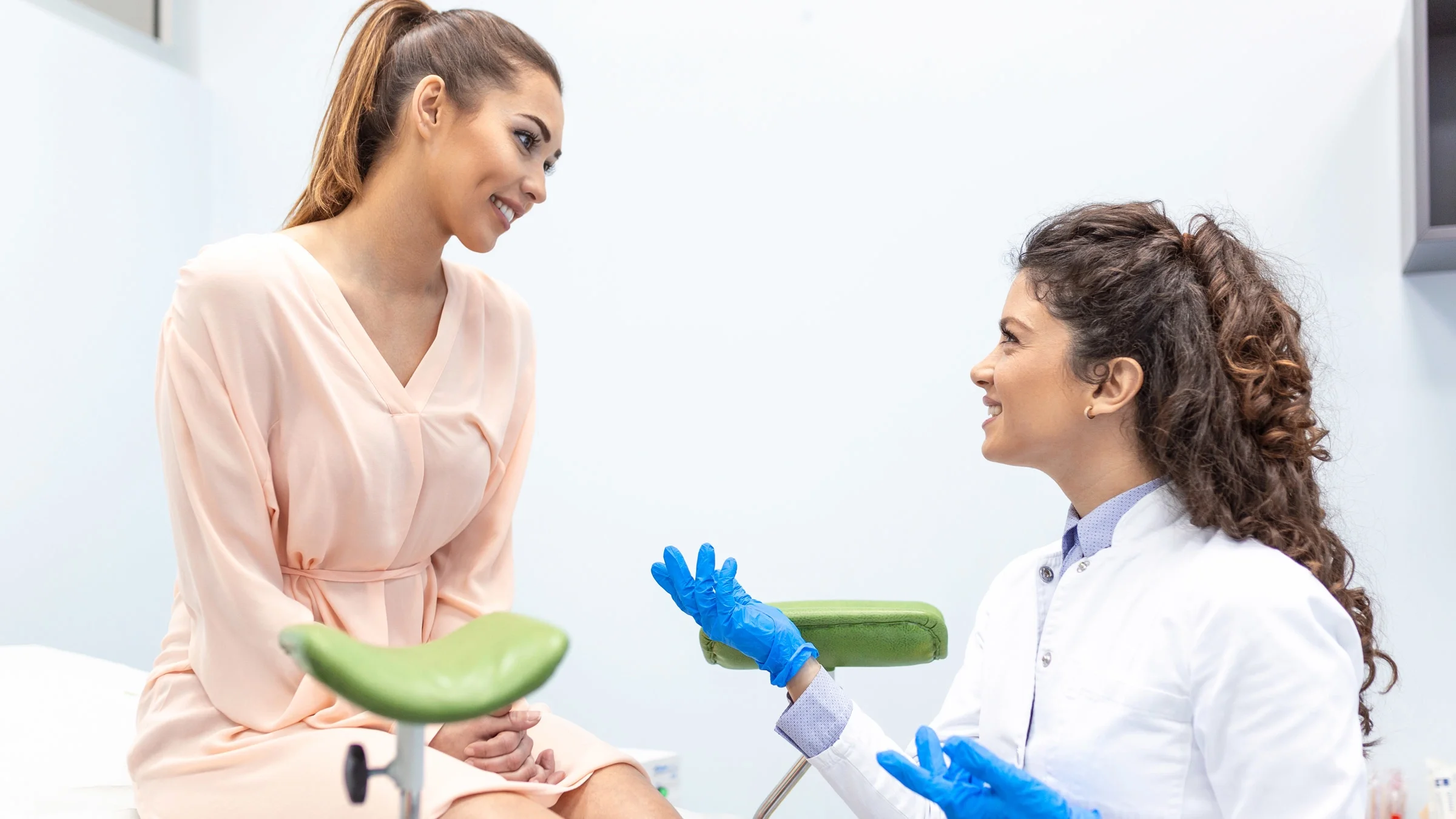 A gynecologist and patient talking.