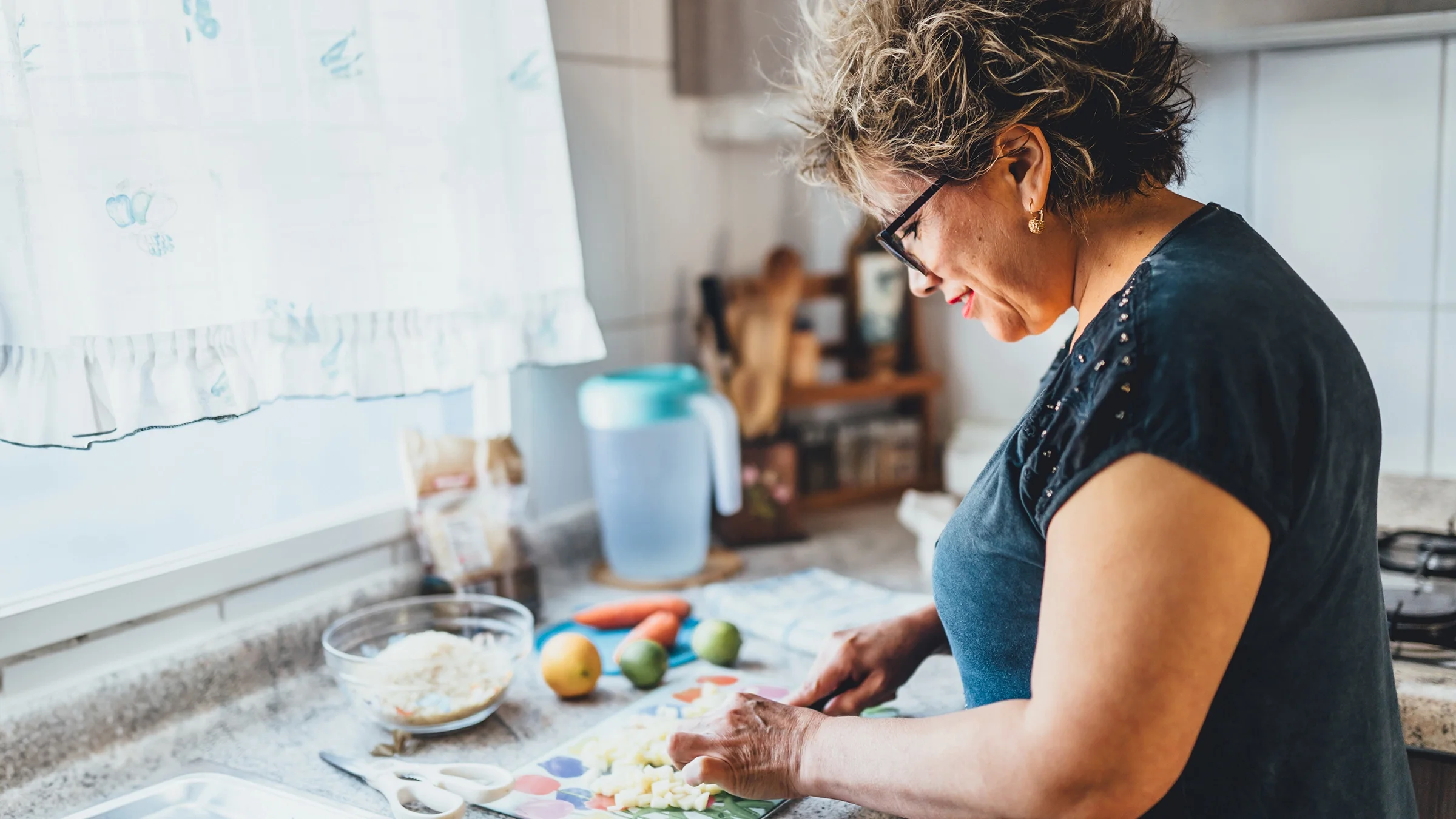 Woman preparing a meal at home.