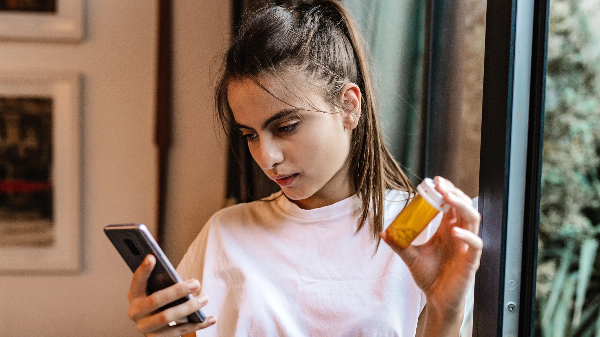 A woman is searching online about medication.