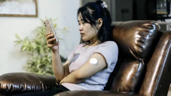 Diabetes: woman wearing glucose meter 1778170990